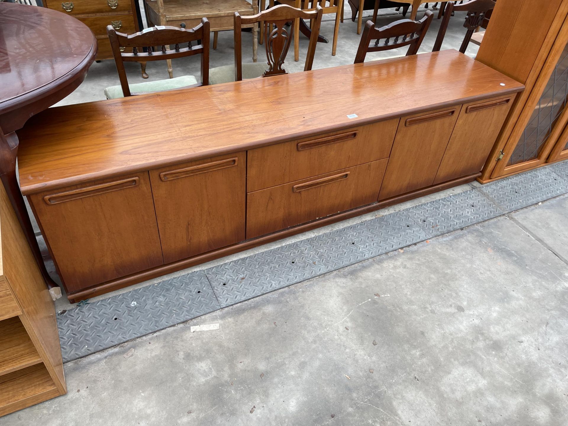 A MEREDREW RETRO TEAK SIDEBOARD ENCLOSONG TWO DRAWERS AND FOUR CUPBOARDS 79" WIDE