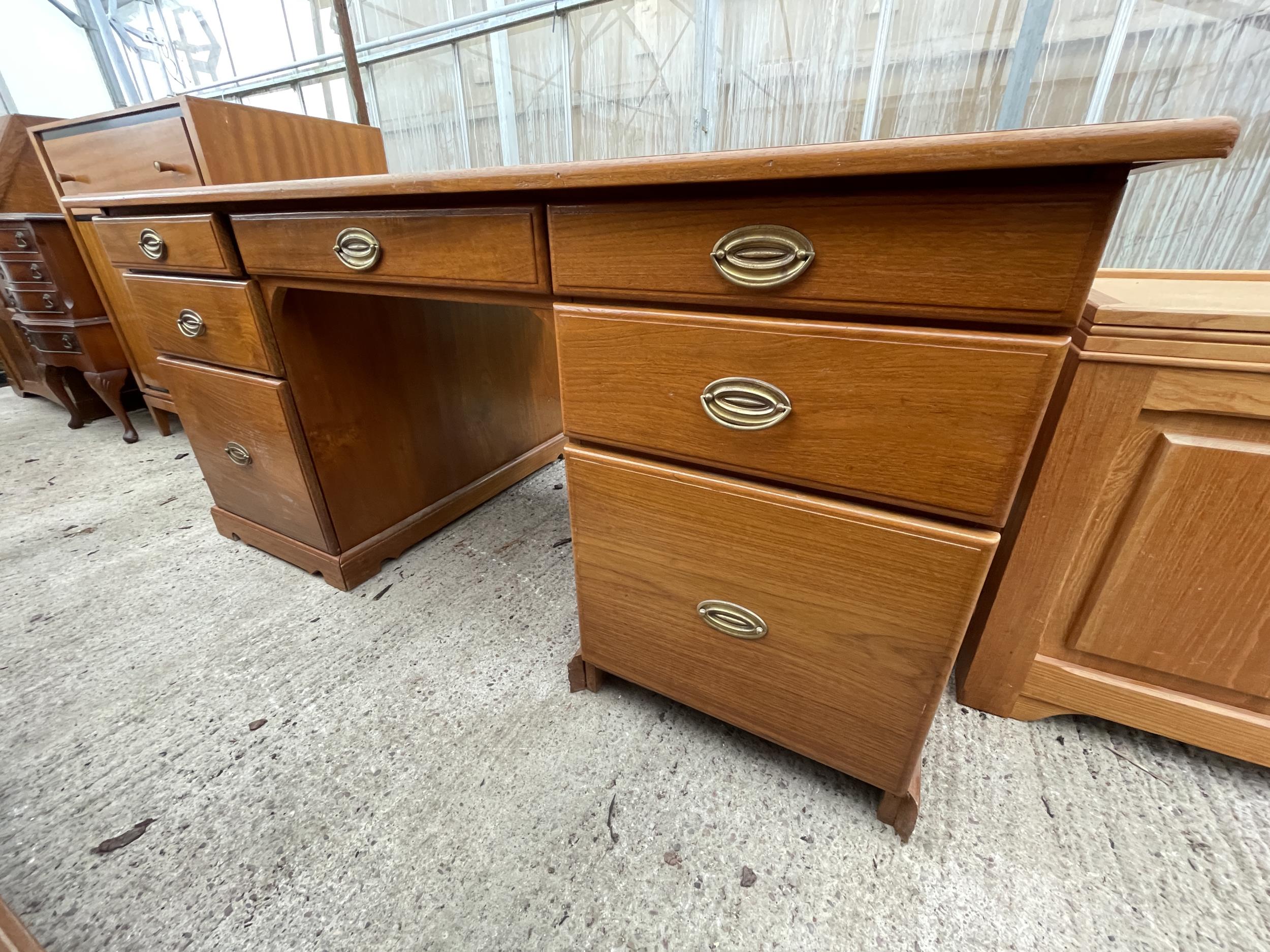 A RETRO TEAK TWIN PEDESTAL DESK ENCLOSING SEVEN DRAWERS 63" X 36" - Image 2 of 3