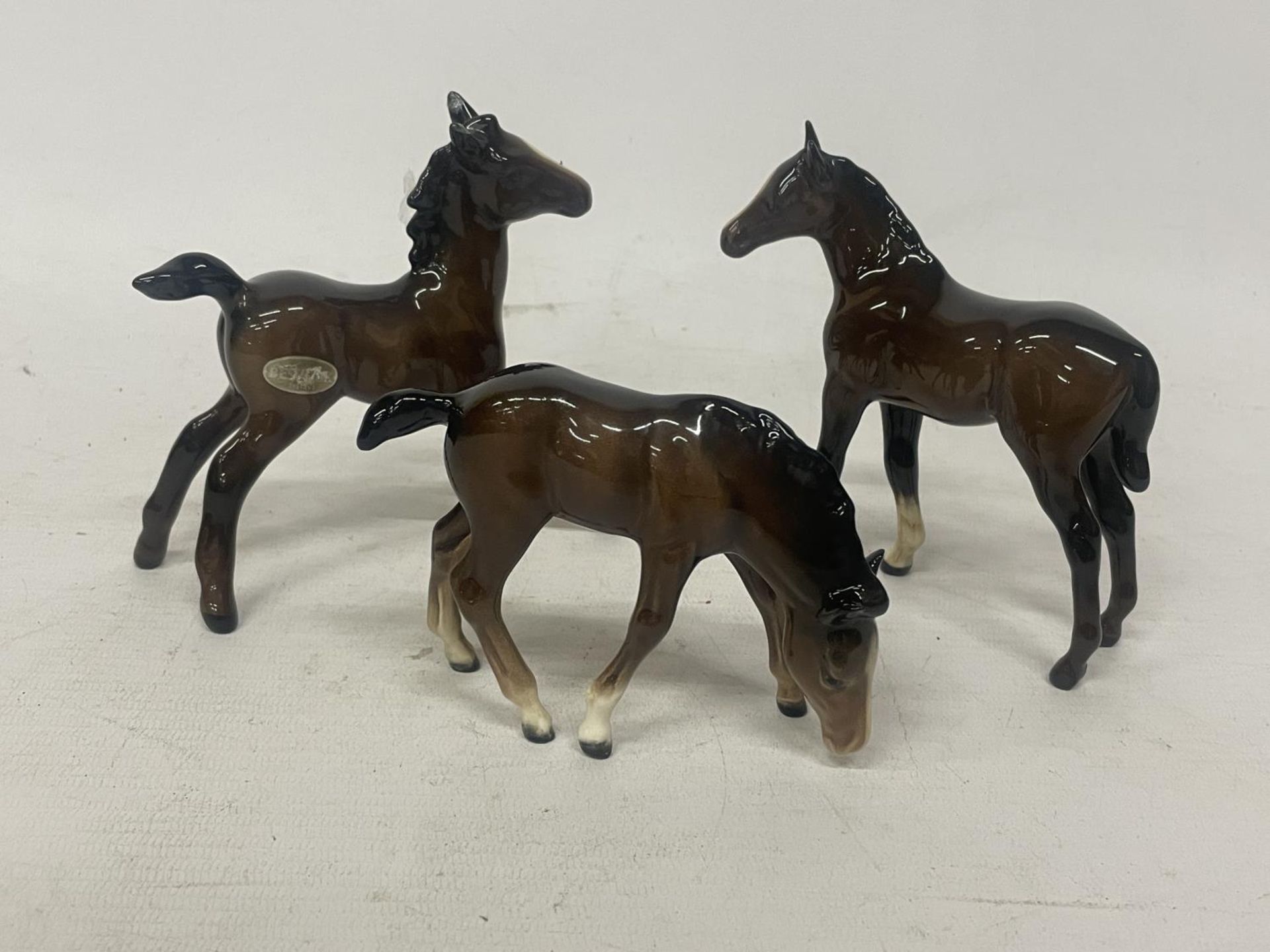 THREE VARIOUS BESWICK FOALS