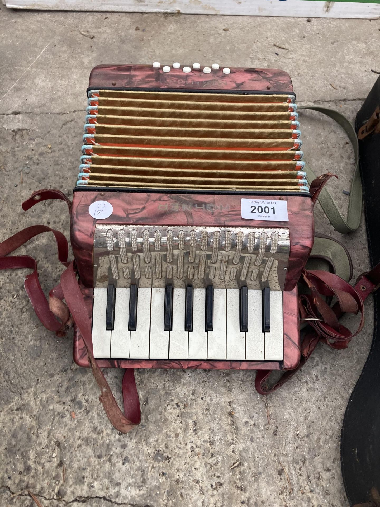 A SMALL HOHNER ACCORDIAN