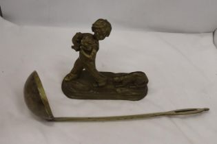 A BRASS FIGURE OF A BOY WITH PUPPY DOGS, HEIGHT 20CM, WIDTH 20CM TOGETHER WITH A BRASS LADEL