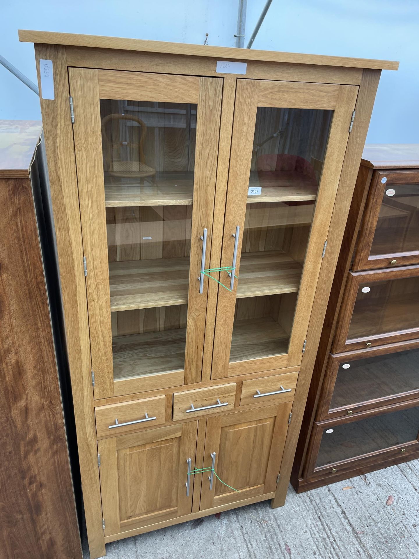 A MODERN J.B. GLOBAL OAK TWO DOOR GLAZED CABINET WITH DRAWERS AND CUPBOARD TO BASE - 36 INCH WIDE