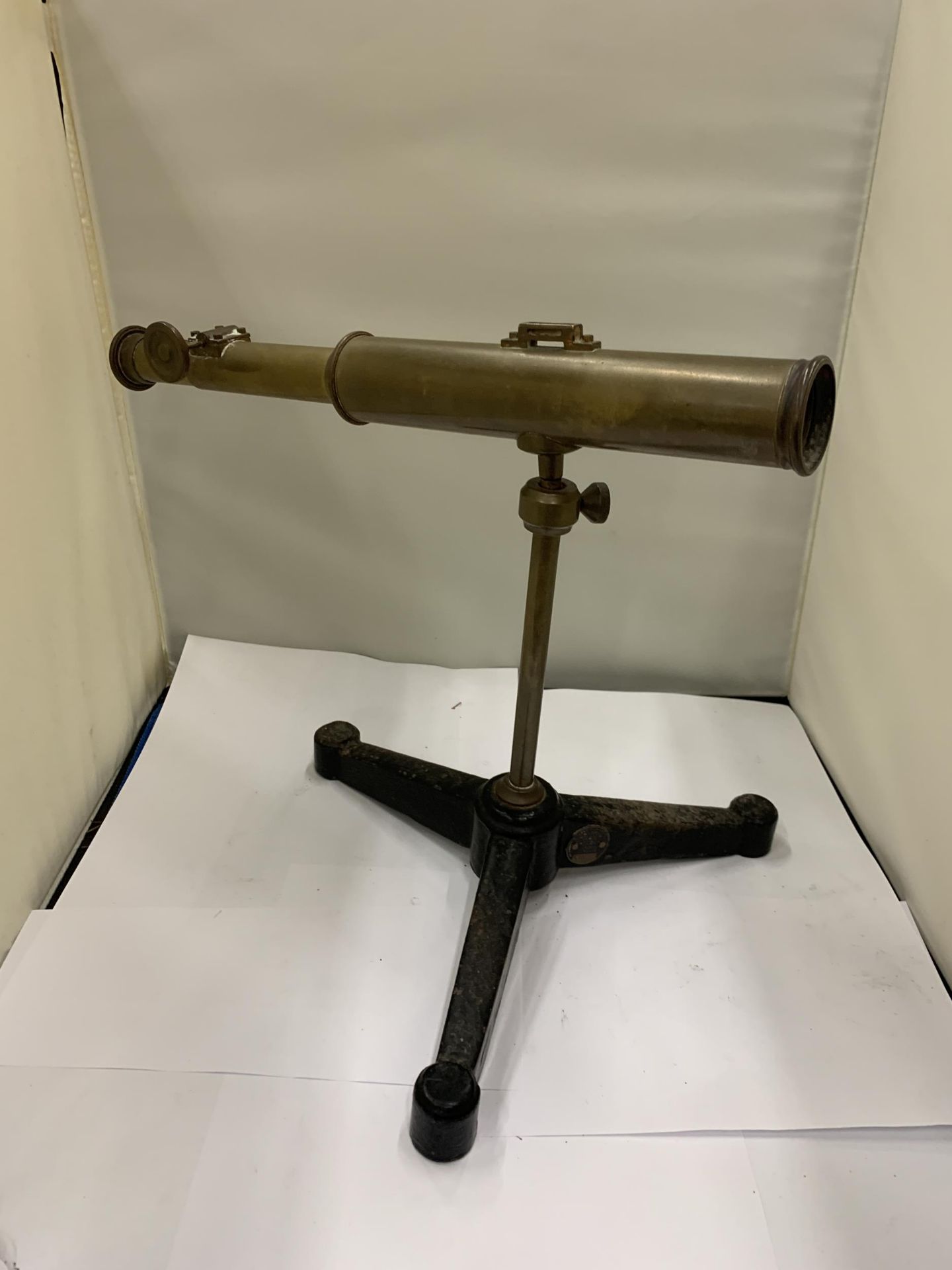 A VINTAGE BRASS TELESCOPE ON A CAST TRIPOD STAND - Image 2 of 3