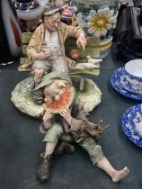 TWO ITALIAN CAPODIMONTE STYLE FIGURES TO INCLUDE AN OLD MAN ON A BENCH FEEDING BIRDS AND A BOY