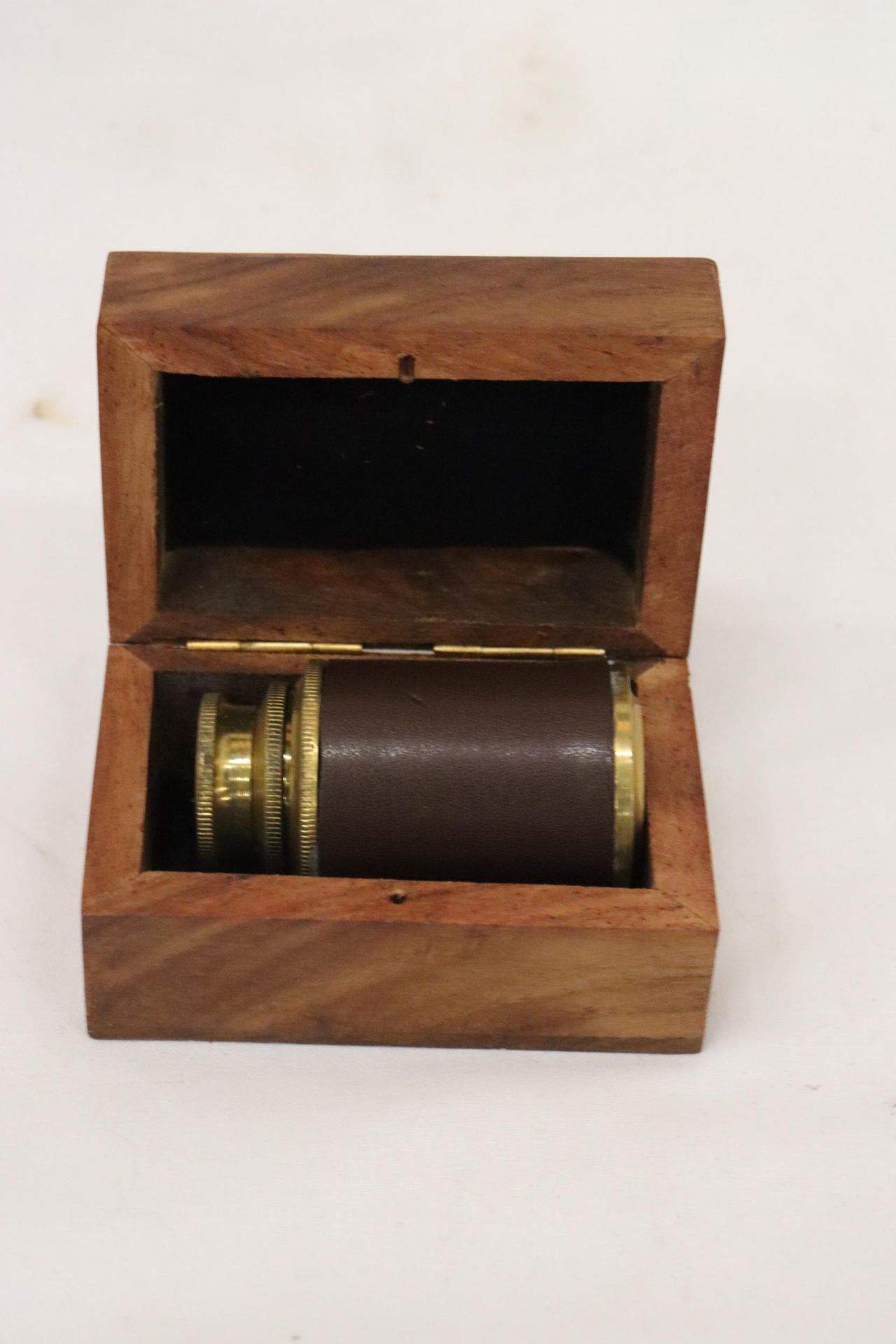 A BOXED BRASS AND LEATHER TELESCOPE