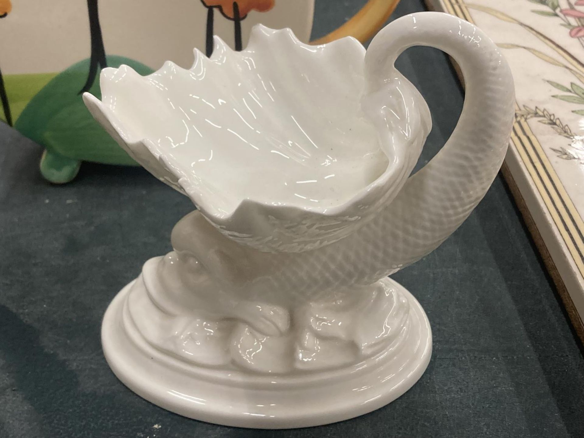 A ROYAL WORCESTER DOLPHIN SHAPED SOAP DISH