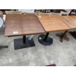 TWO OAK PUB TABLES ON METALWARE BASES 30" SQUARE AND 28" SQUARE