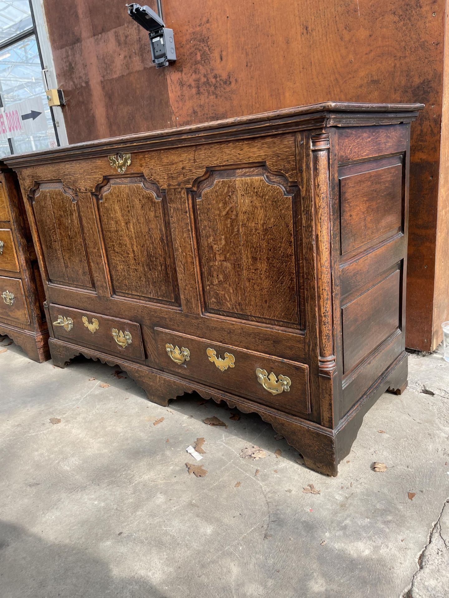 A GEORGE III OAK LANCASHIRE CHEST WITH A THREE PANEL FRONT AND TWO DRAWERS TO BASE ON BRACKET FEET - Image 2 of 6