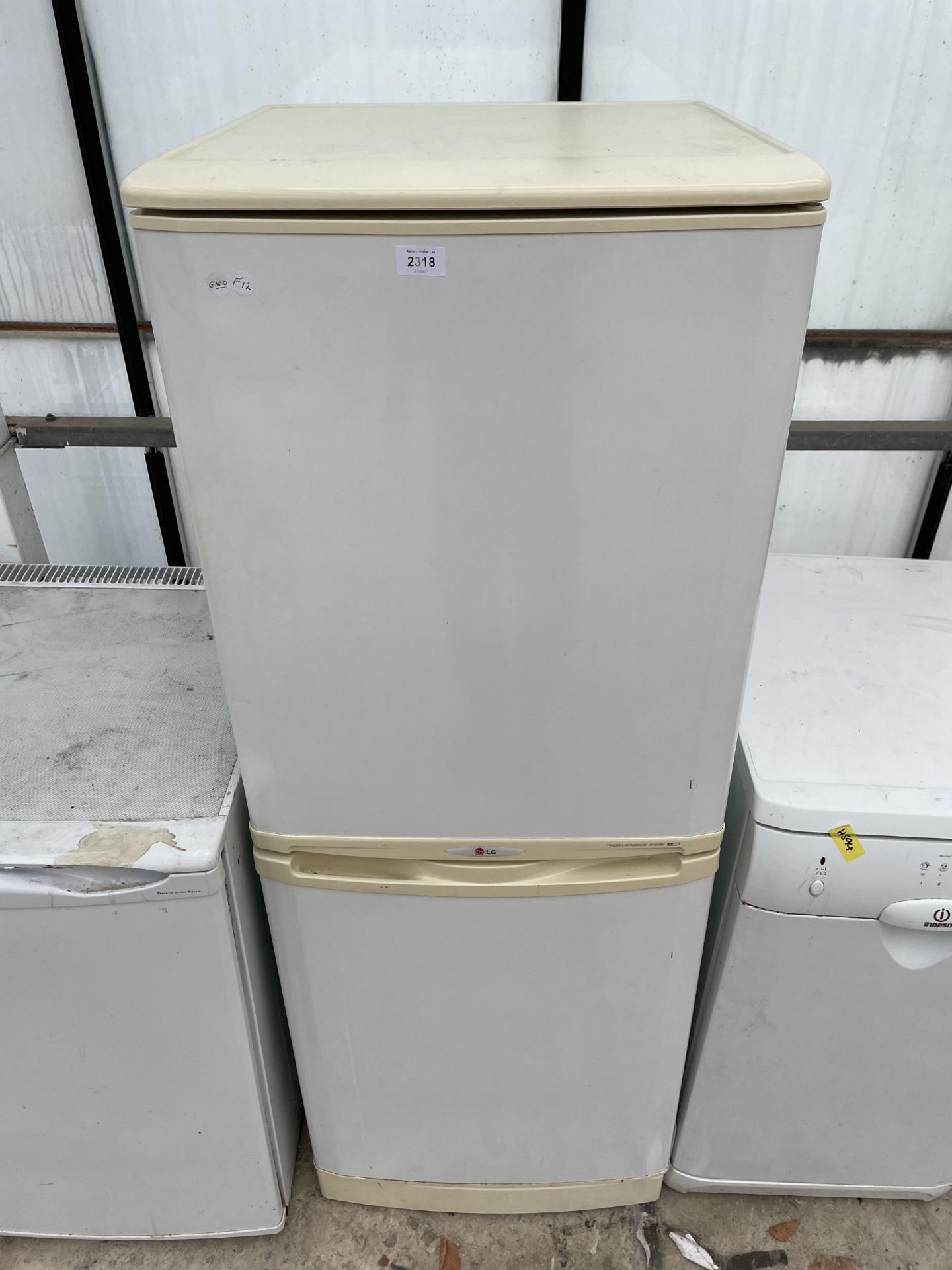 A WHITE UPRIGHT LG FRIDGE FREEZER