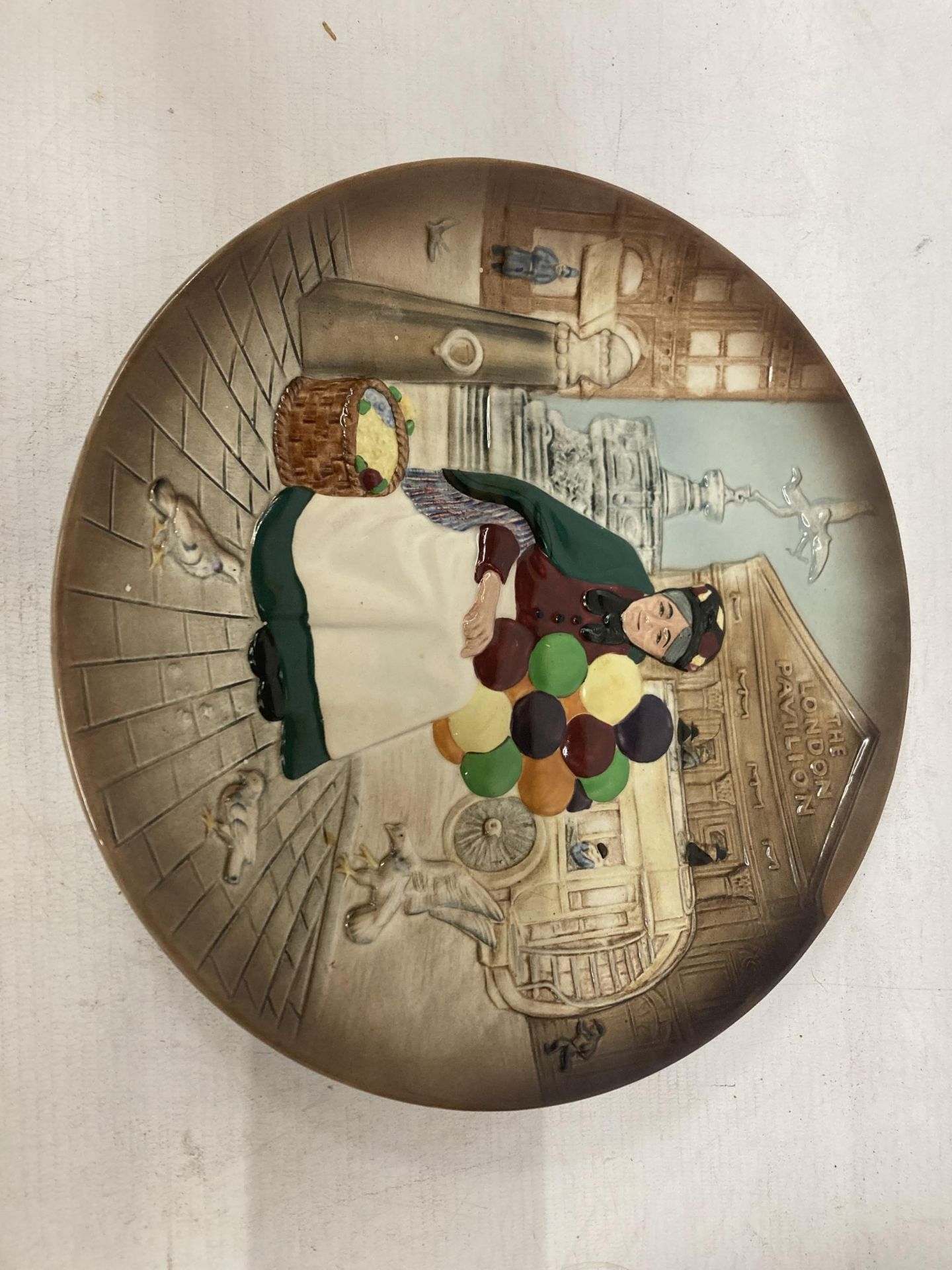 A ROYAL DOULTON PLATE "THE OLD BALLOON SELLER" D6649 (2ND QUALITY)