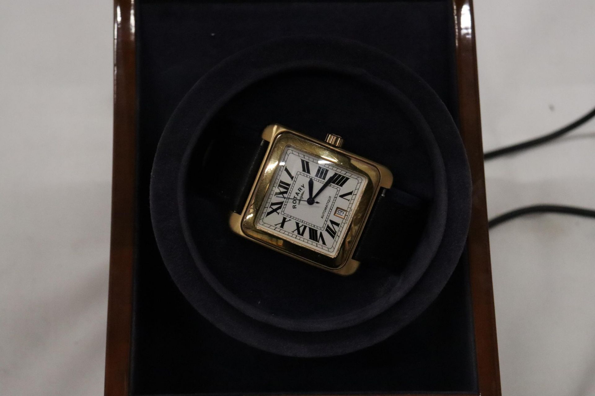 A ROTARY AUTOMATIC WRIST WATCH WITH SQUARE WHITE FACE, ROMAN NUMERALS AND A BLACK LEATHER STRAP - Image 6 of 7