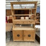 A VICTORIAN PINE KITCHEN DRESSER ENCLOSING SHELVES, THREE DRAWERS AND FOOD CUPBOARD TO BASE 40" WIDE