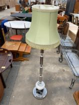 A 1970'S STANDARD LAMP WITH SHADE ON A POLISHED METAL COLUMN WITH CUBE BASE