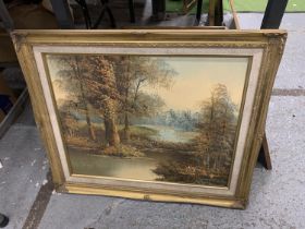 A GILT FRAMED OIL ON CANVAS OF A WOOD AND RIVER SCENE, 62CM X 52CM