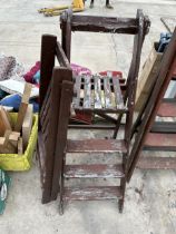 TWO VINTAGE WOODEN STEP LADDERS TO INCLUDE A 3 RUNG AND A 2 RUNG