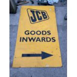 A LARGE METAL JCB GOODS INWARDS SIGN