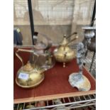 THREE SMALL BRASS AND COPPER KETTLES AND A BRASS CHERUB CANDLE STICK