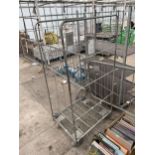 A LARGE METAL WAREHOUSE FOUR WHEELED CAGE