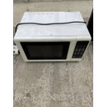 A WHITE KENWOOD MICROWAVE OVEN