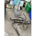 AN ASSORTMENT OF TOOLS TO INCLUDE A GALVANISED WATERING CAN AND TWO GREASE GUNS ETC