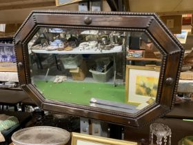 A VINTAGE MAHOGANY FRAMED OCTAGONAL MIRROR, 69CM X 46CM