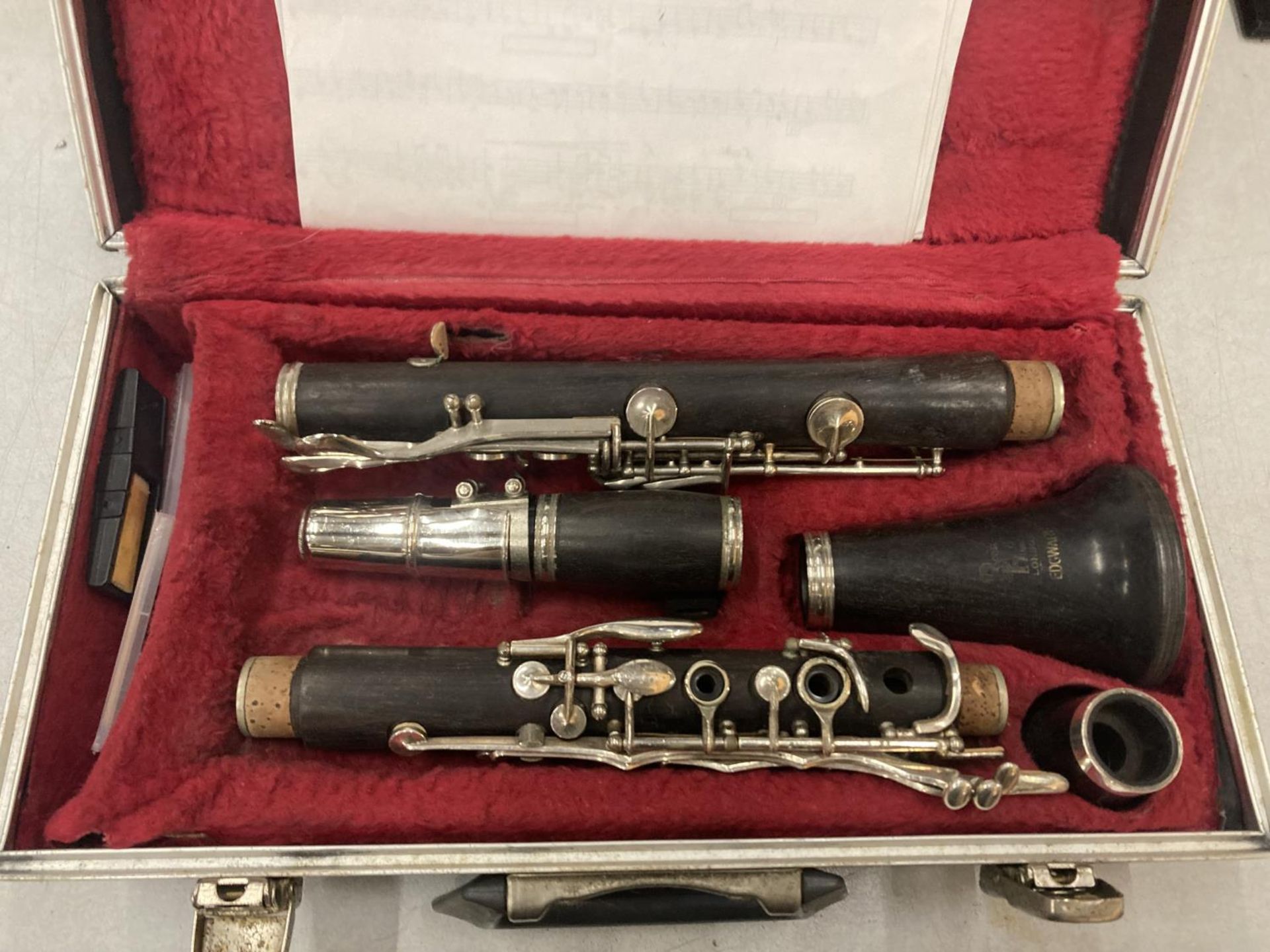 A BOOSEY AND HAWKES EBONISED CLARINET IN A CASE