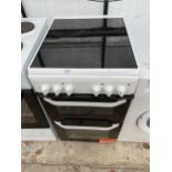 A WHITE AND BLACK HOTPOINT ELECTRIC OVEN AND HOB BELIEVED IN WORKING ORDER BUT NO WARRANTY