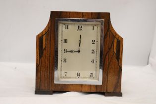A DECO STYLE OAK 8 DAY MANTLE CLOCK WITH WIND UP MECHANISM SEEN WORKING BUT NO WARRANTY
