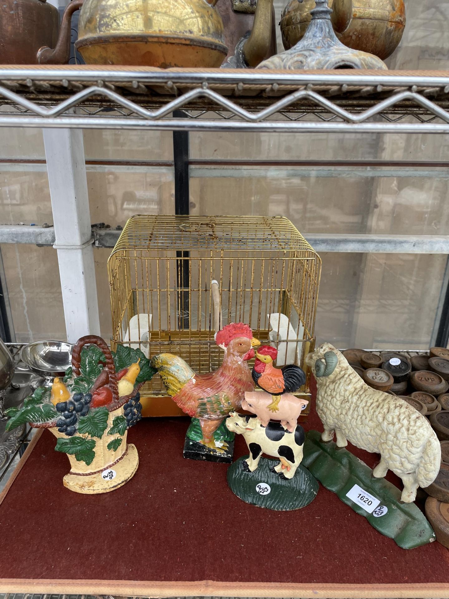 AN ASSORTMENT OF ITEMS TO INCLUDE A BIRD CAGE AND FOUR CAST IRON DOOR STOPS