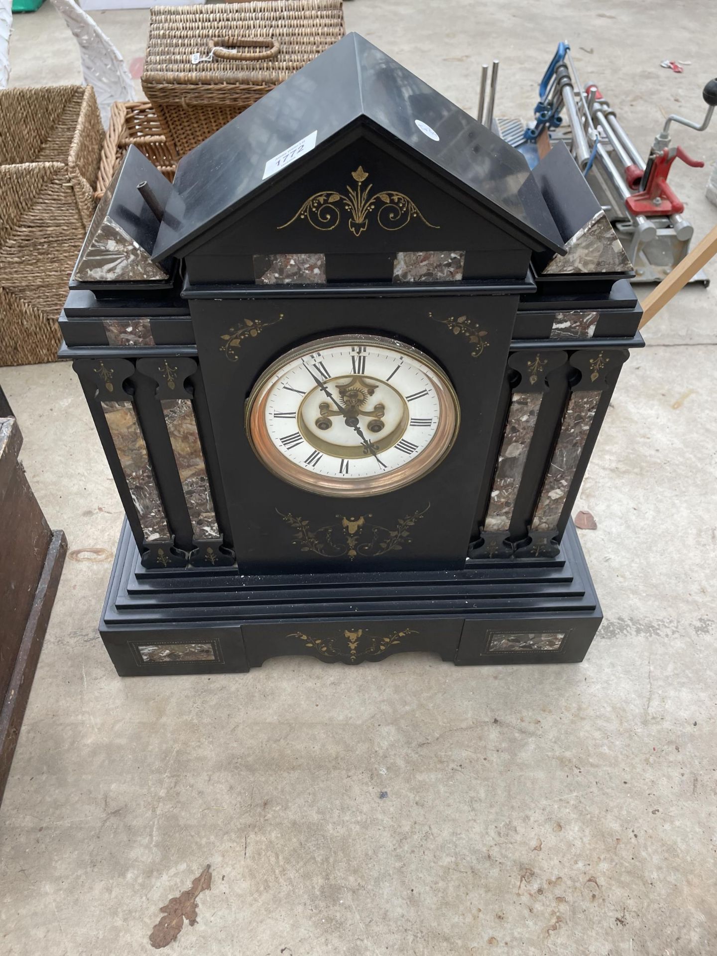 A LARGE HEAVY SLATE MANTLE CLOCK WITH WINDING KEY