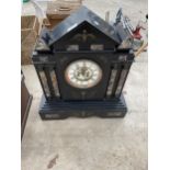 A LARGE HEAVY SLATE MANTLE CLOCK WITH WINDING KEY