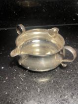 A HALLMARKED LONDON SILVER DOUBLE SPOUTED JUG WITH TWIN HANDLES GROSS WEIGHT 106 GRAMS