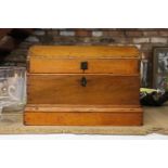 A LARGE WOODEN CHEST WITH STUDDED DETAIL