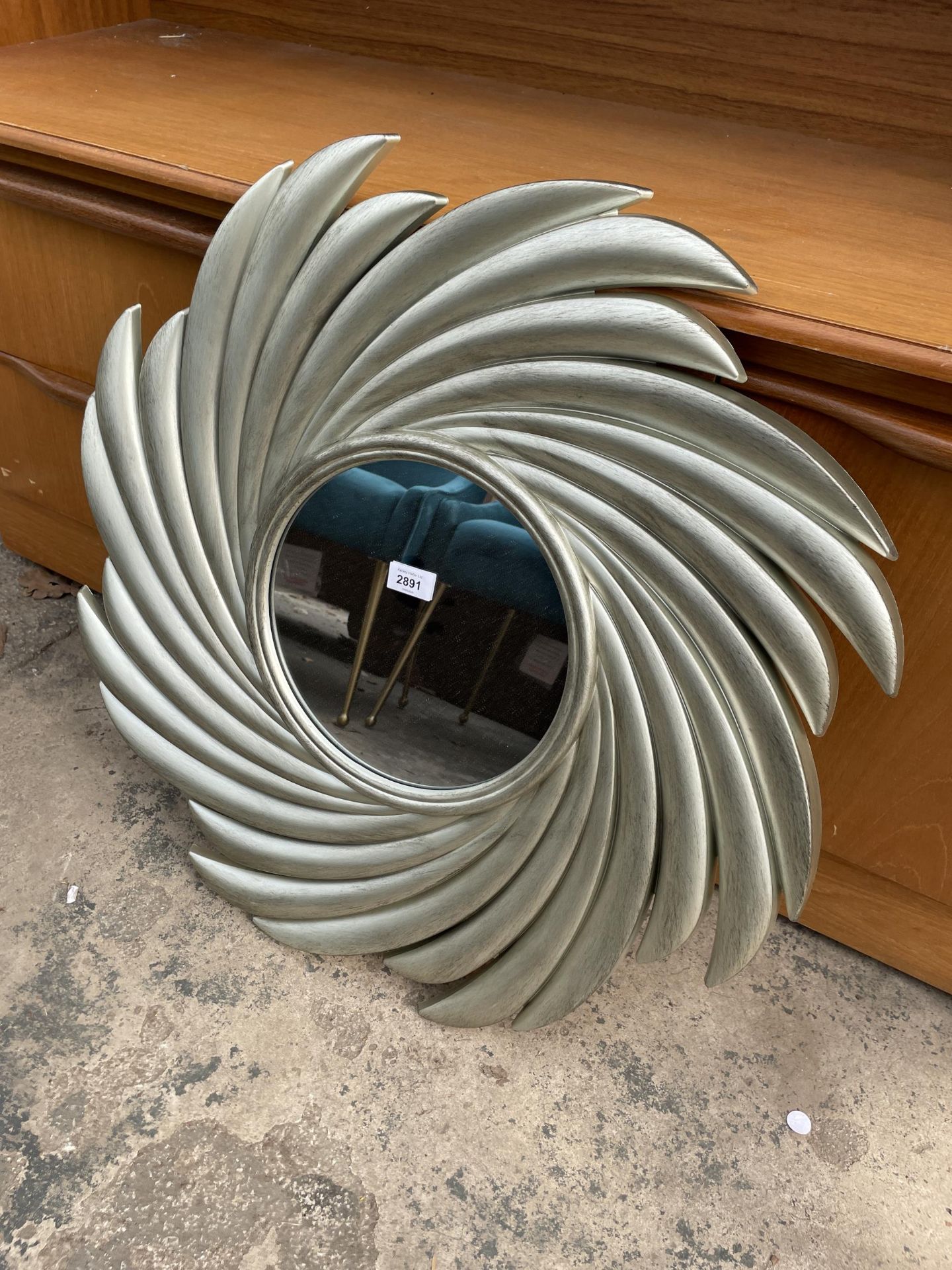 A MODERN DUNELM SILVER SWIRL MIRROR