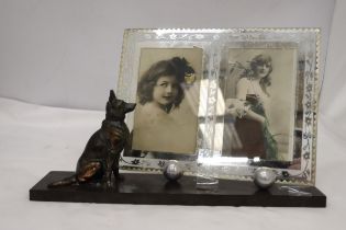 AN ART DECO DOUBLE PHOTO FRAME ON A PLINTH FEATURING A GERMAN SHEPHERD DOG FIGURE