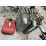 TWO GREEN METAL JERRY CANS AND A SMALL RED FUEL CAN