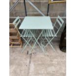 A TALL METAL FOLDING PATIO TABLE AND TWO FOLDING STOOLS