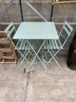 A TALL METAL FOLDING PATIO TABLE AND TWO FOLDING STOOLS