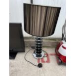 A DECORATIVE TABLE LAMP WITH SHADE