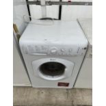 A WHITE HOTPOINT 7KG WASHING MACHINE BELIEVED IN WORKING ORDER BUT NO WARRANTY