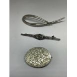 THREE SILVER BROOCHES