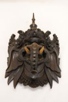 A WOODEN INDONESIAN GANESH MASK