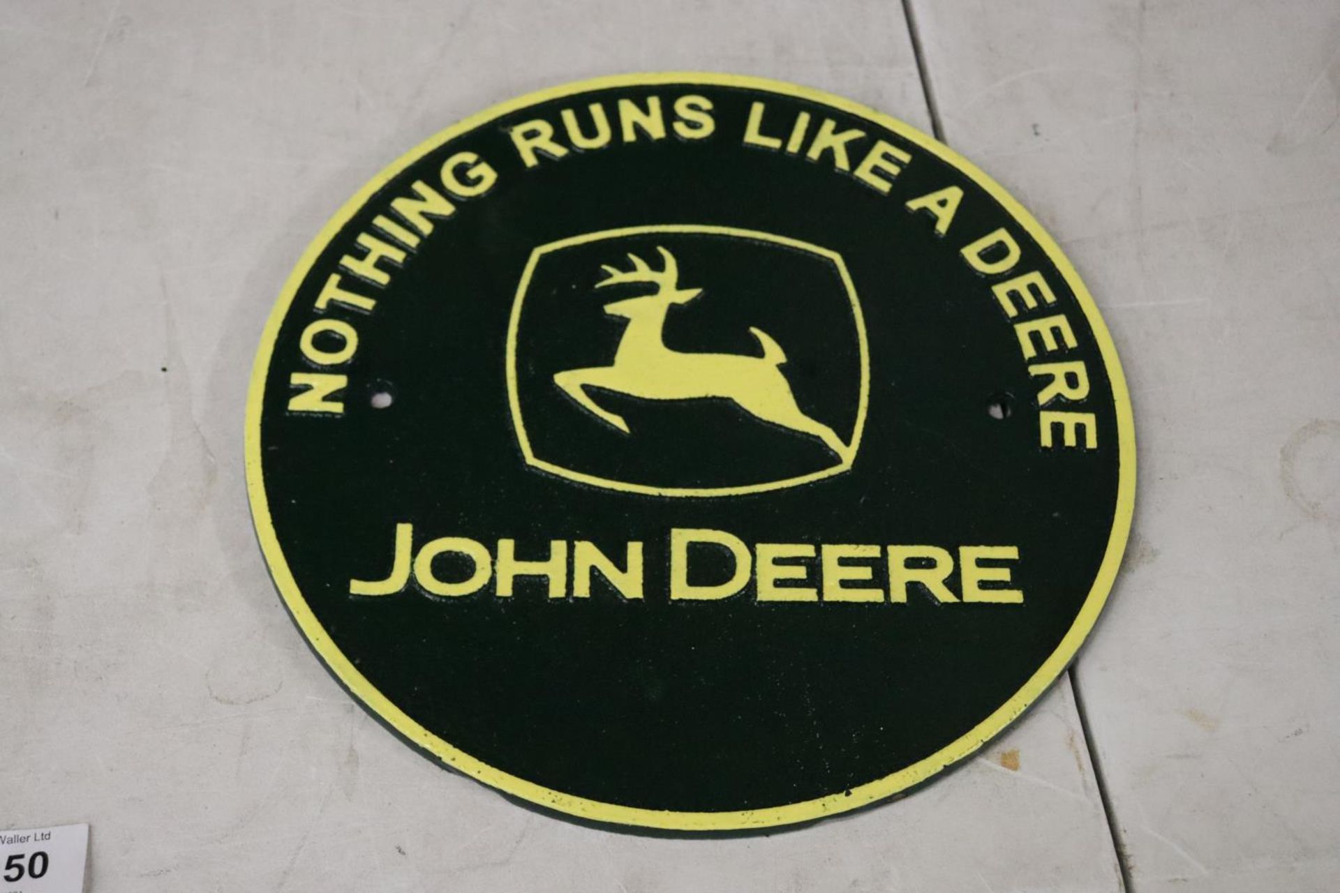 A CAST JOHN DEERE SIGN