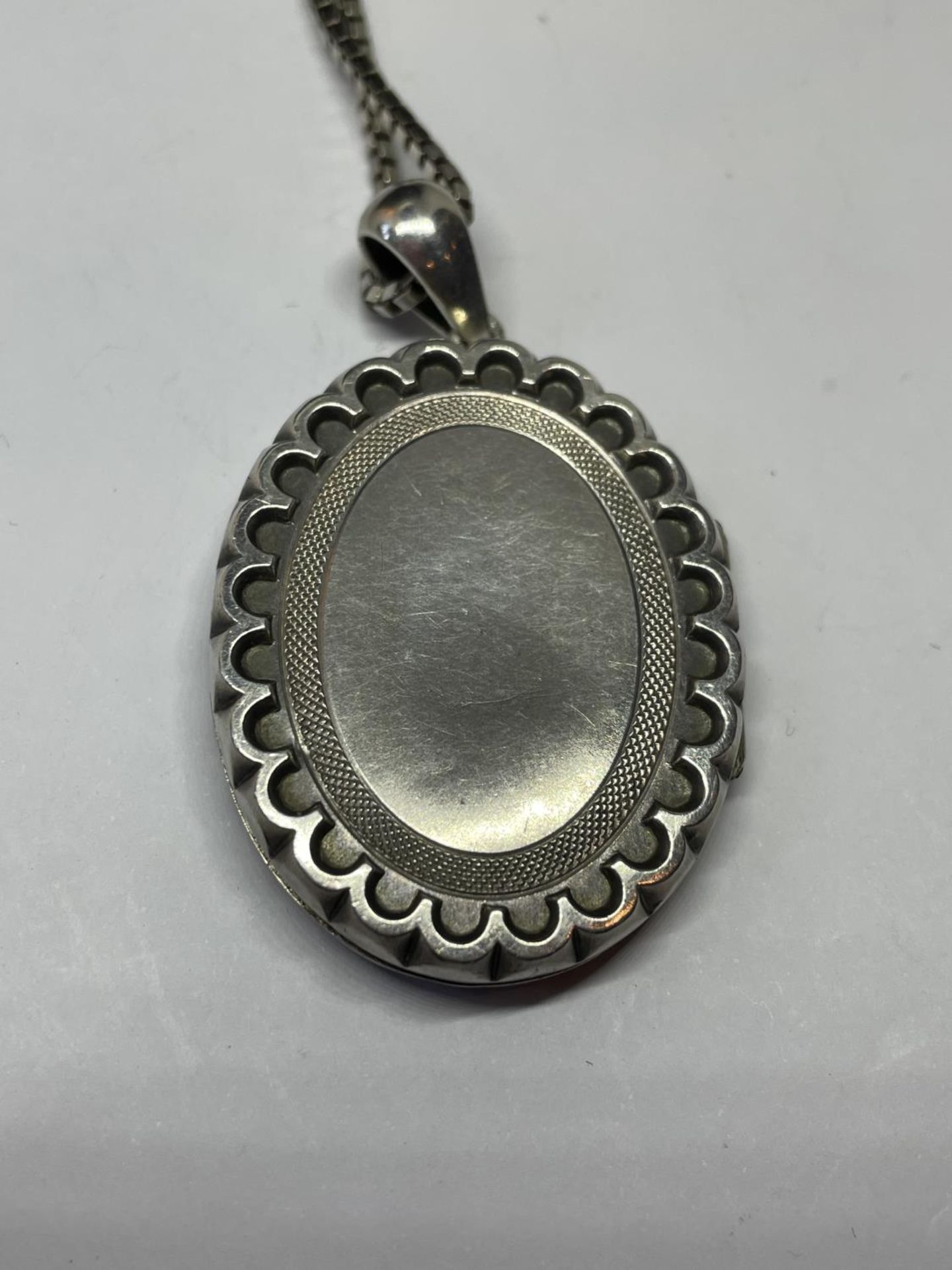 A WWI SILVER LOCKET AND CHAIN - Image 3 of 4