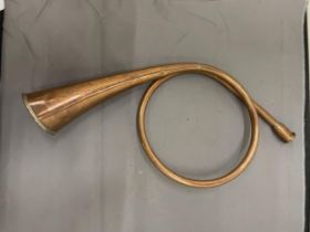 A COPPER, COILED HUNTING HORN