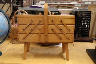A WOODEN CANTILEVER SEWING BOX