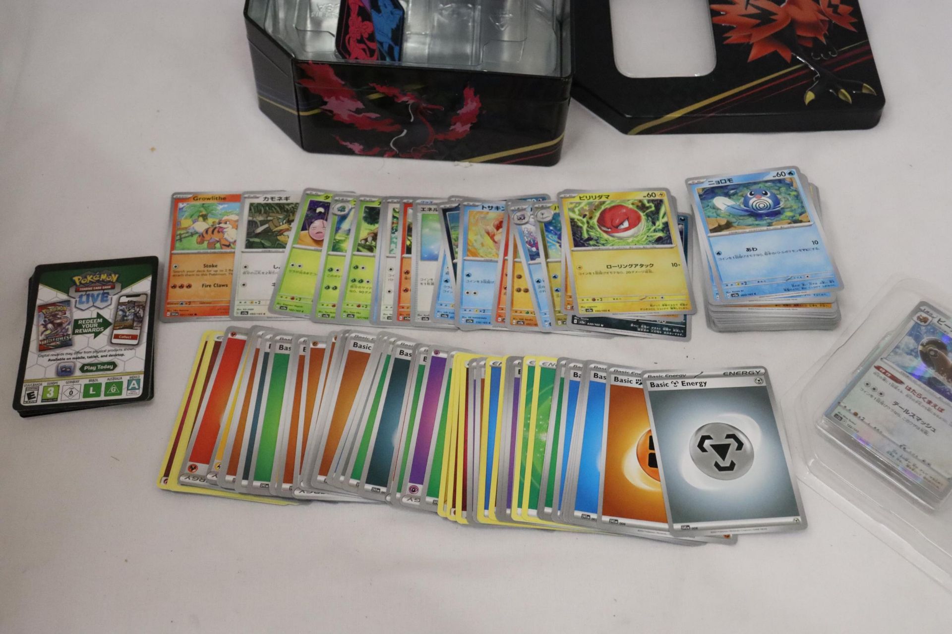 A POKEMON COLLECTOR'S TIN FULL OF JAPANESE CARDS