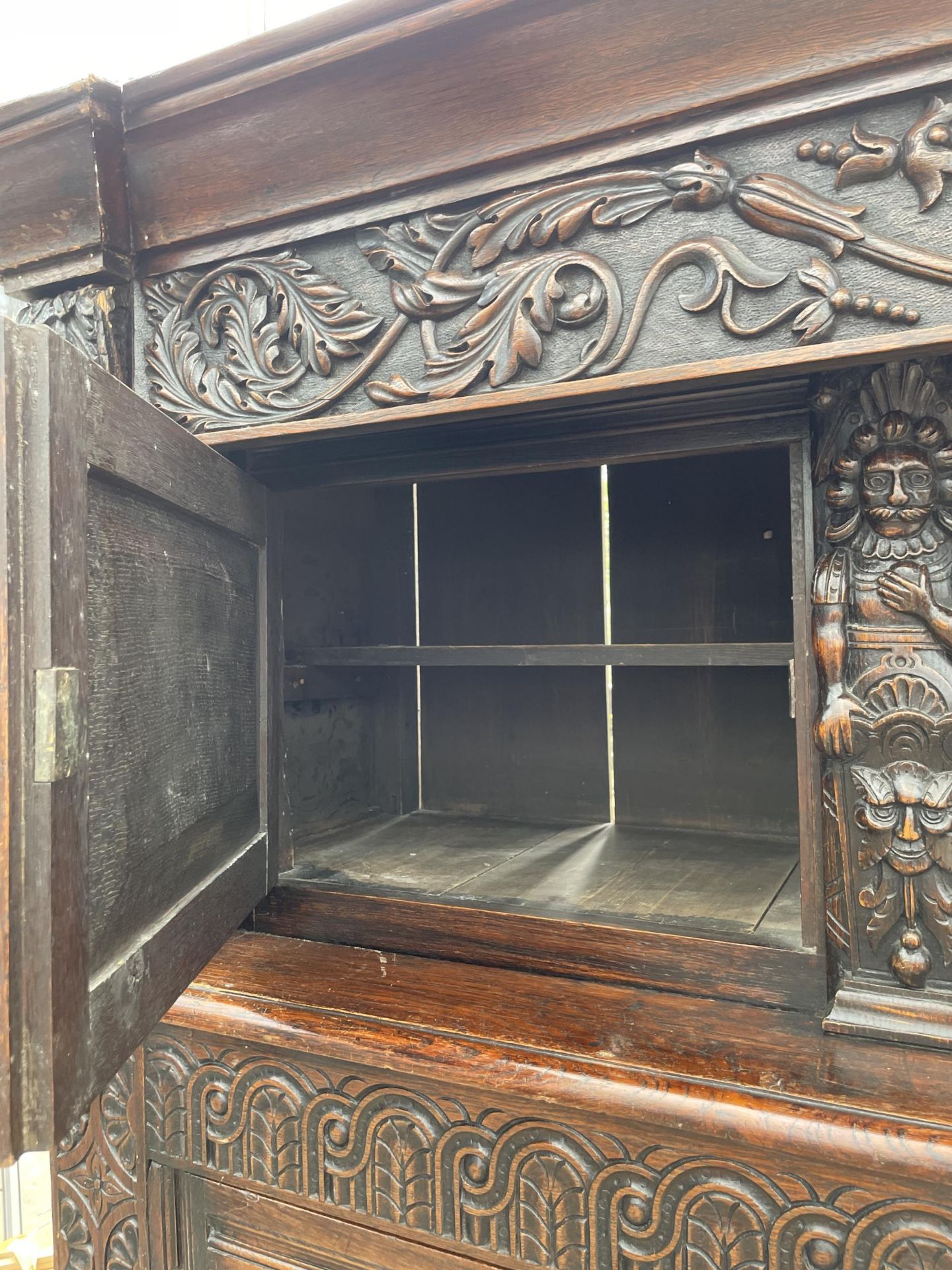 AN OAK GEORGE III STYLE COURT CUPBOARD WITH CARVED PANELS, THREE DEPICTING THE BIRTH AND CRUCIFIXION - Image 9 of 12