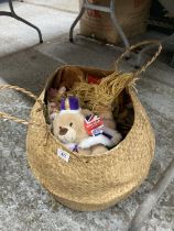 A BASKET CONTAINING A QUANTITY OF SOFT TOYS SOME WITH TAGS