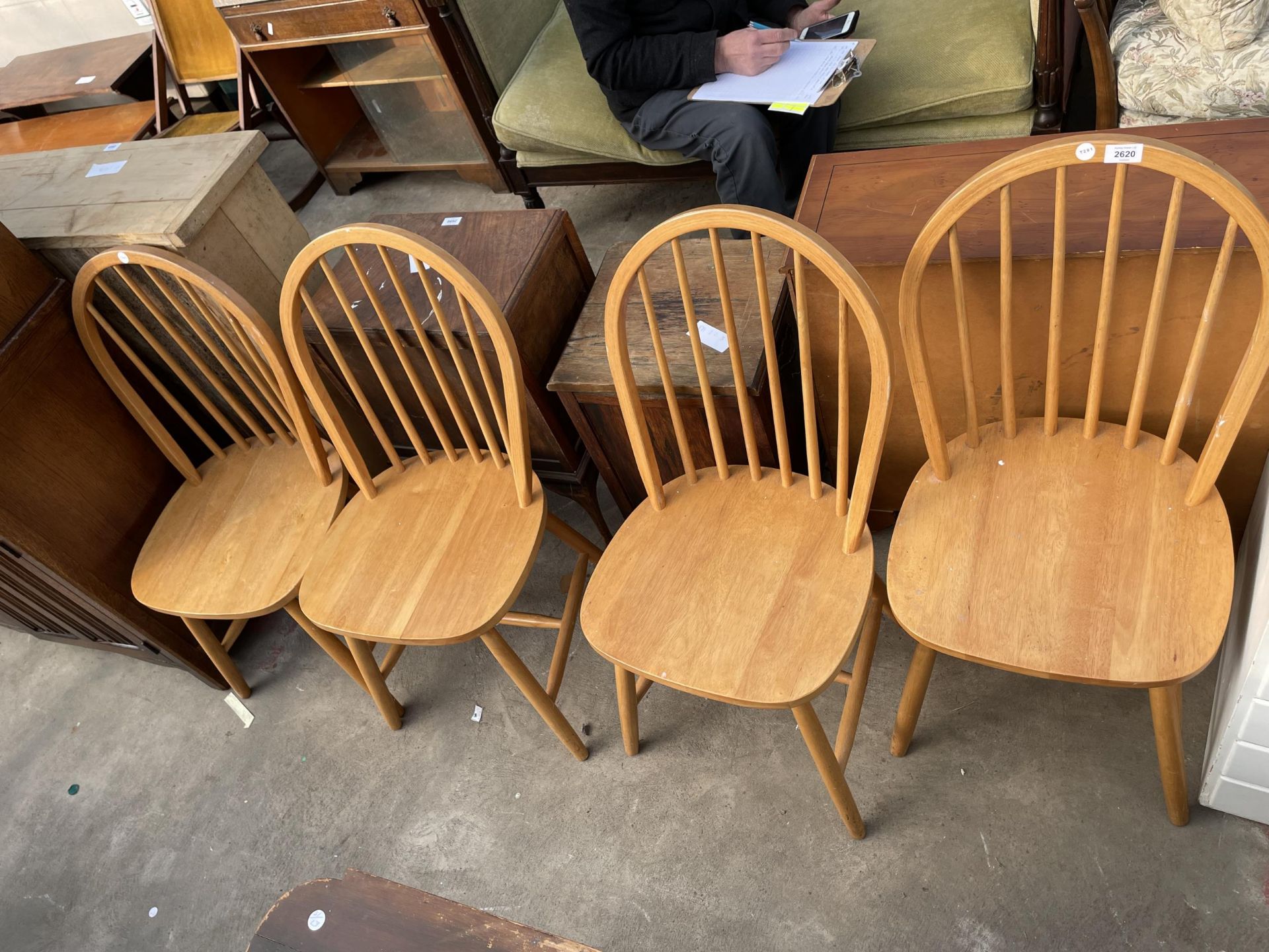 A SET OF FOUR WINDSOR STYLE KITCHEN CHAIRS